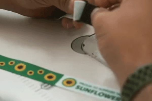 People of Determination manufacture the Sunflower lanyard for distribution in the GCC region